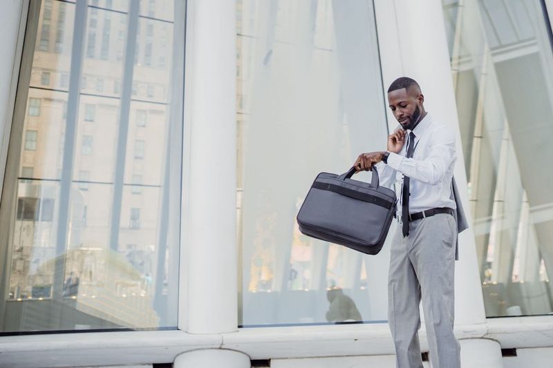 The work bag that carries a laptop, lunch and soccer snacks